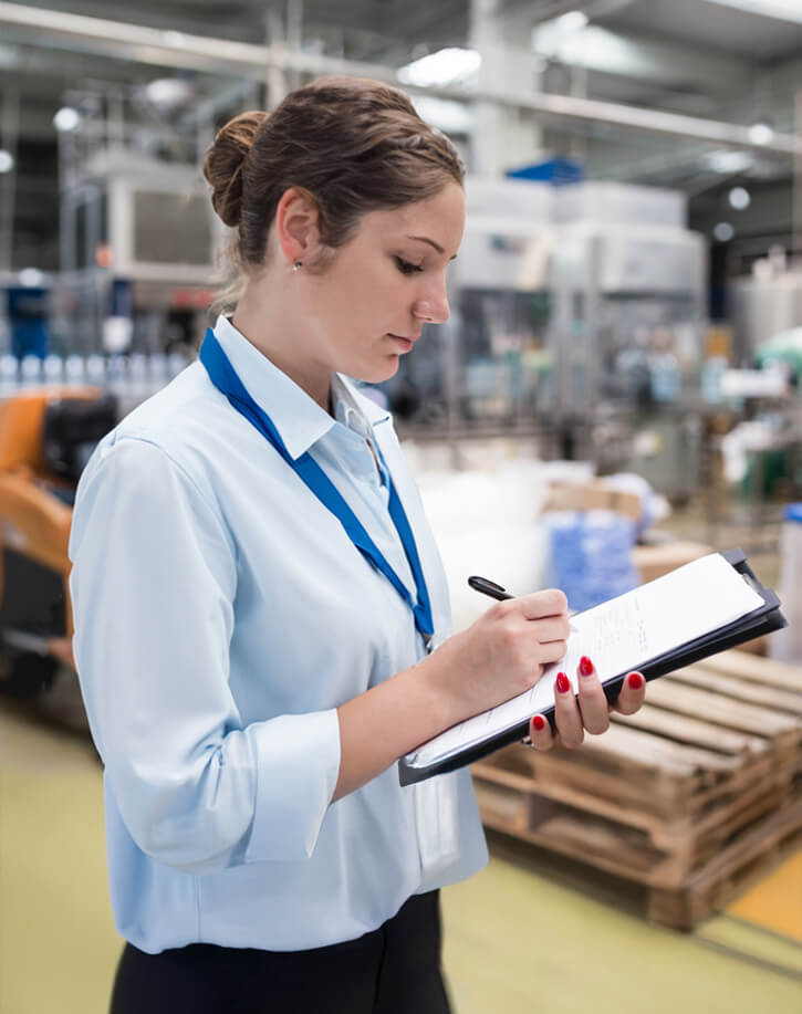Woman-with-clipboard-performing-quality-assurance